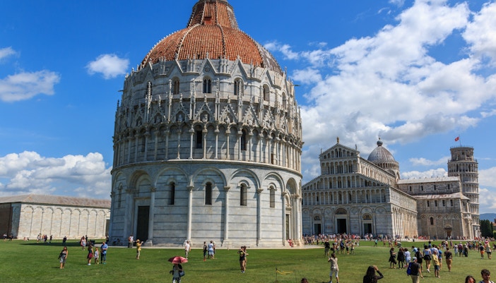 Pisa Baptistery with intricate Romanesque architecture in Piazza dei Miracoli, Italy.