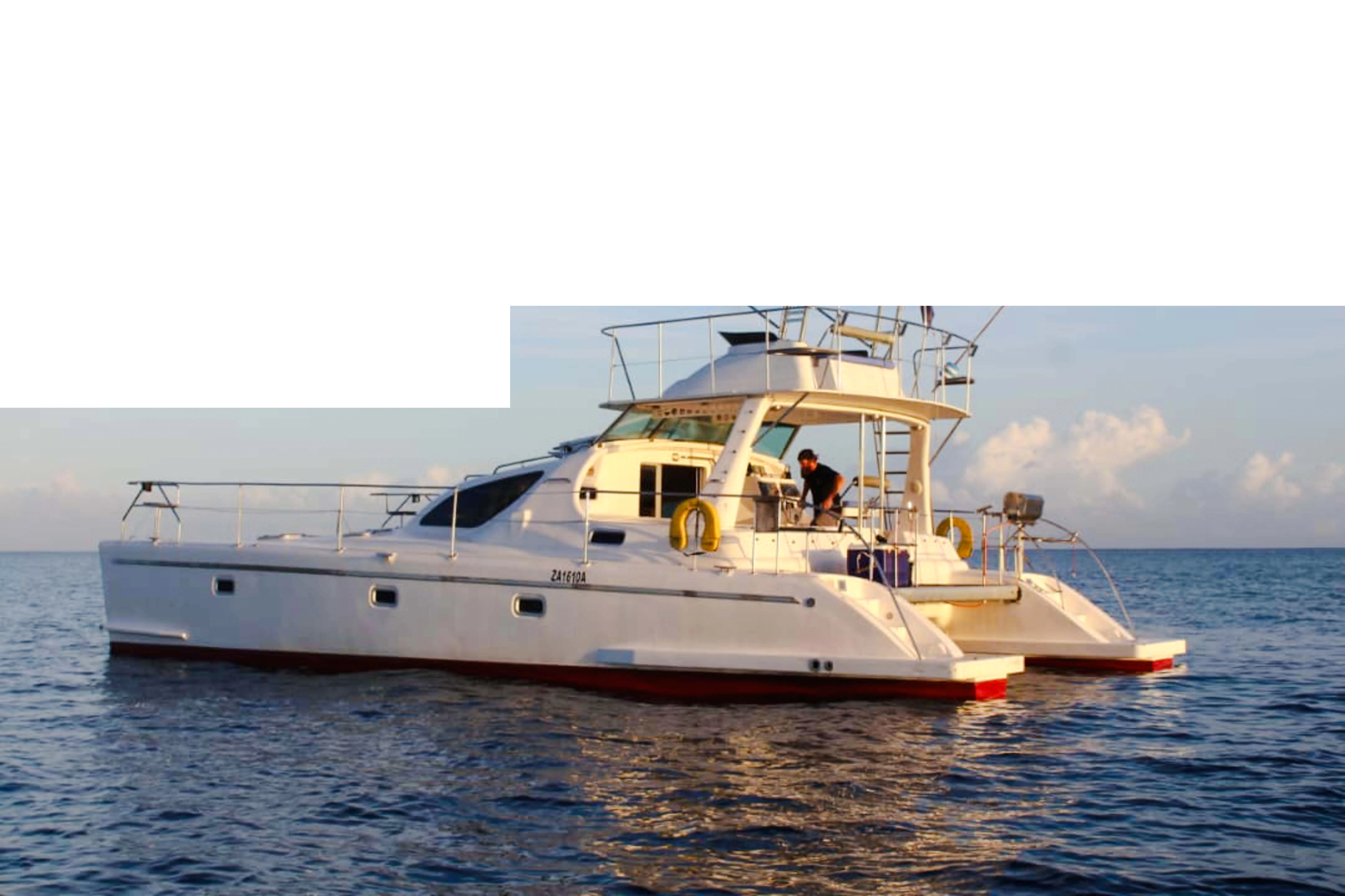 Catamaran on the ocean for private deep-sea fishing charter, Zanzibar.