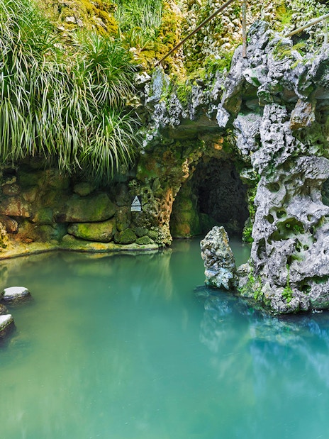 Stepping stones over water in a grotto at Quinta da Regaleira, Sintra.