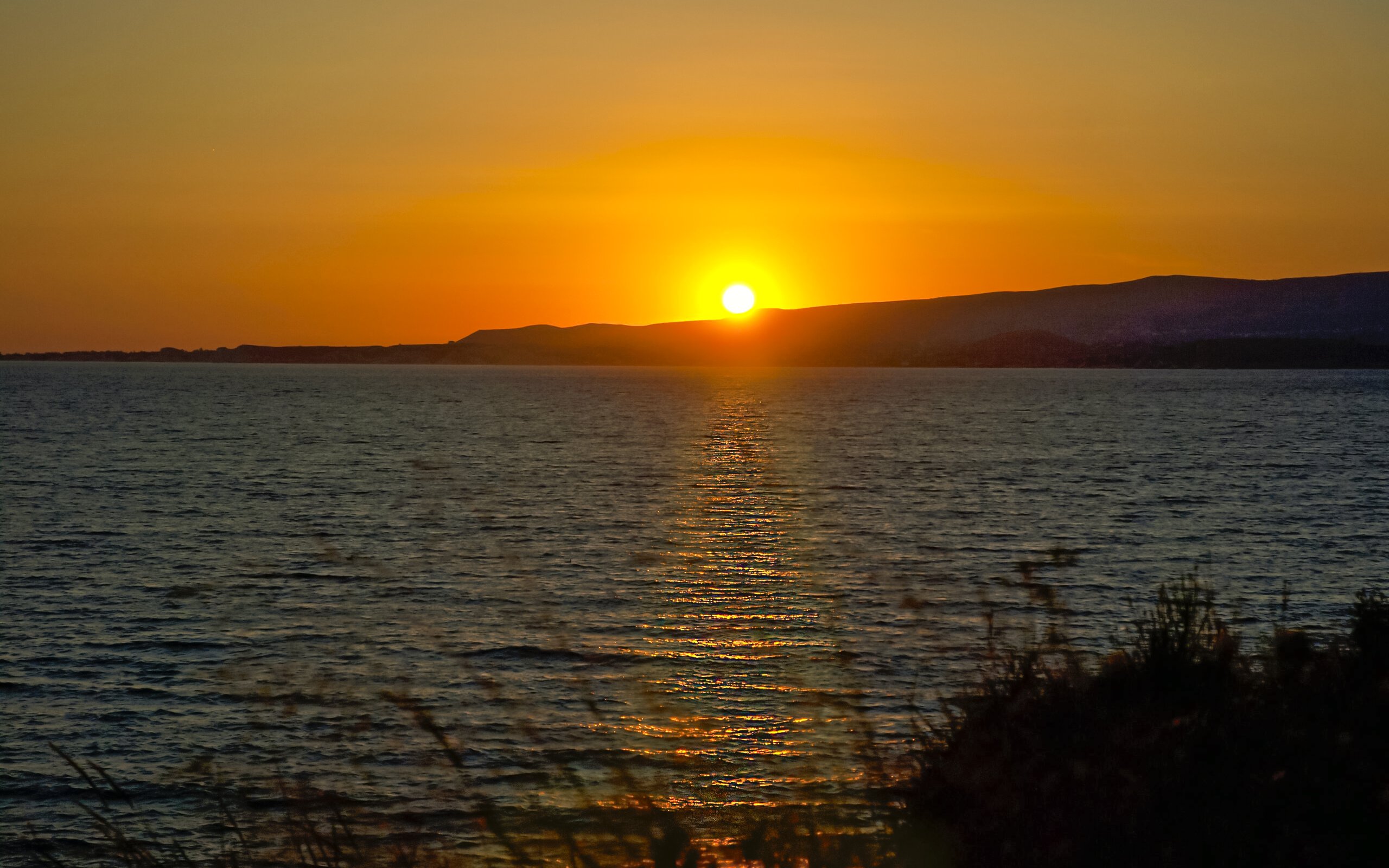 Sunset view over the sea from a cruise in Kefalonia.