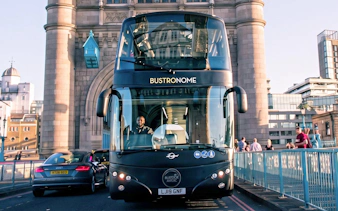 Bustronome bus crossing Tower Bridge in London.
