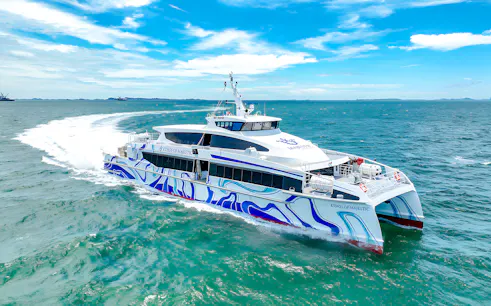 Ferry sailing from Singapore to Batam across blue ocean waters.