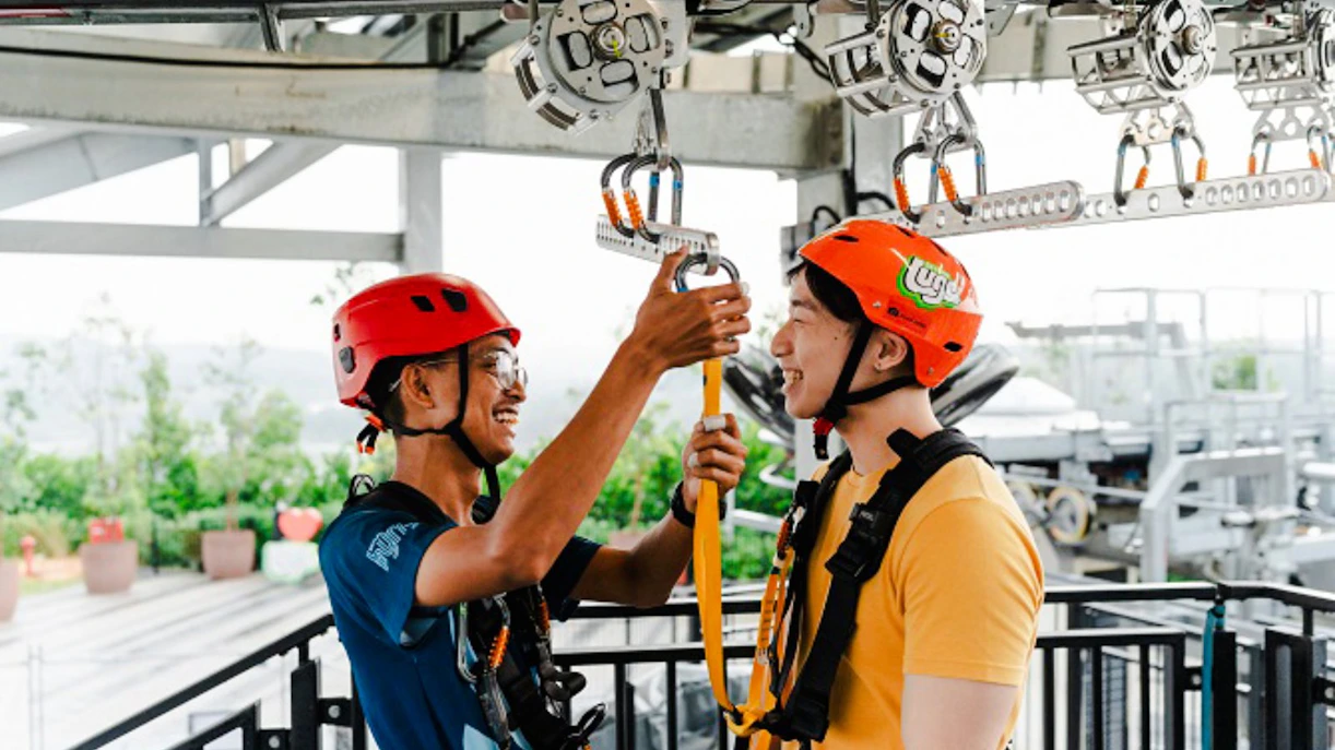 Participants preparing for Skyline Luge ride with safety gear.