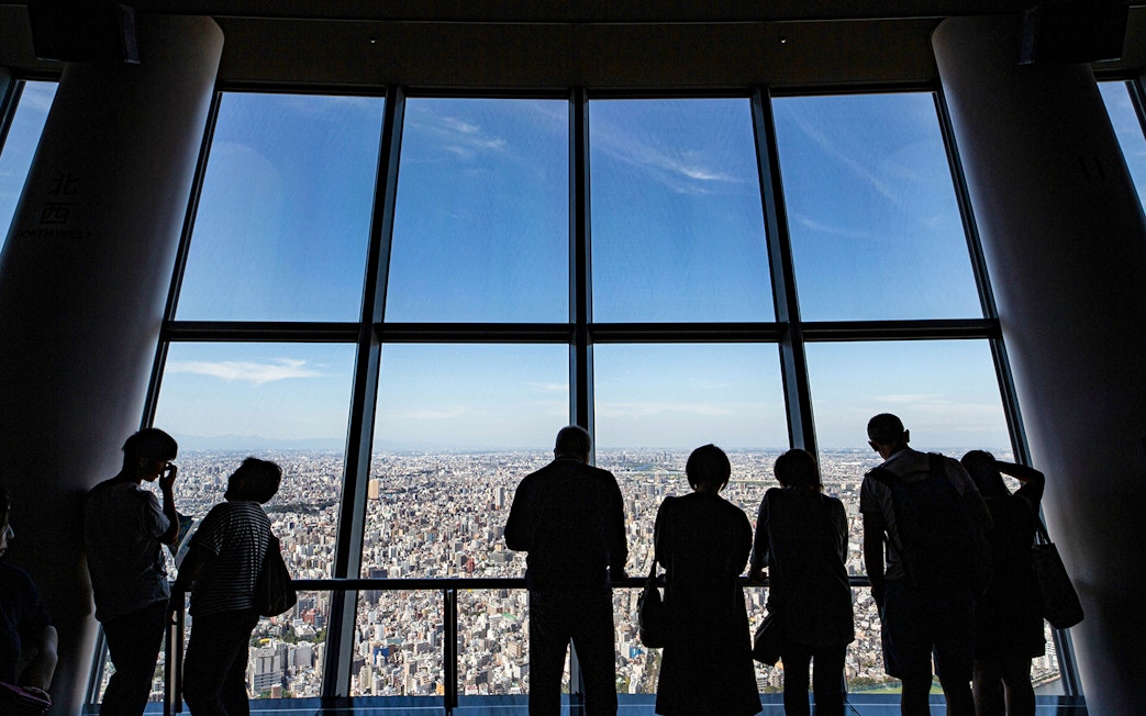 Visitors enjoying city views from Tokyo Skytree Viewing Deck.