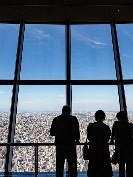 Visitors enjoying city views from Tokyo Skytree Viewing Deck.