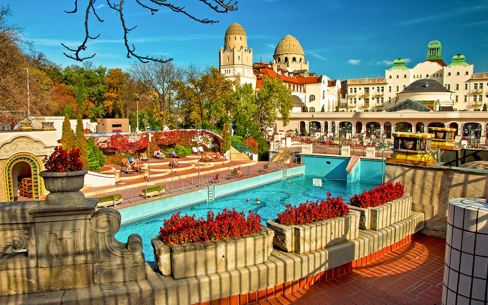 Thermal pools at Budapest Bath with people relaxing and enjoying the historic architecture.
