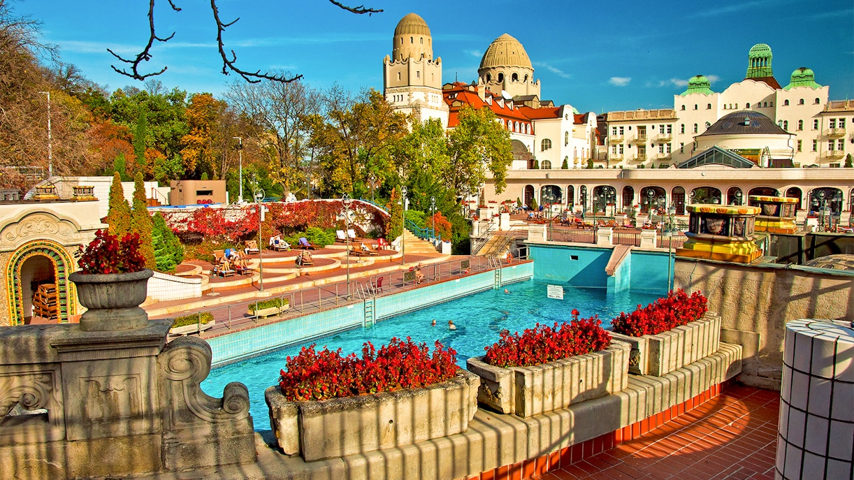 Thermal pools at Budapest Bath with people relaxing and enjoying the historic architecture.