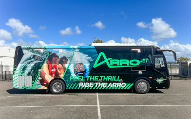 Arro Jet bus with vibrant graphics parked on the Gold Coast.