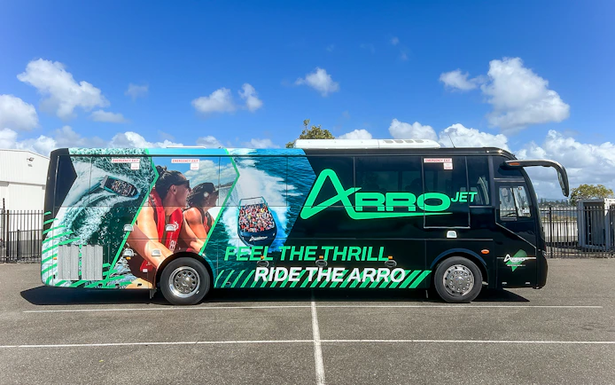 Arro Jet bus with vibrant graphics parked on the Gold Coast.