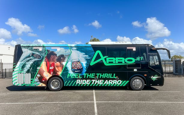 Arro Jet bus with vibrant graphics parked on the Gold Coast.