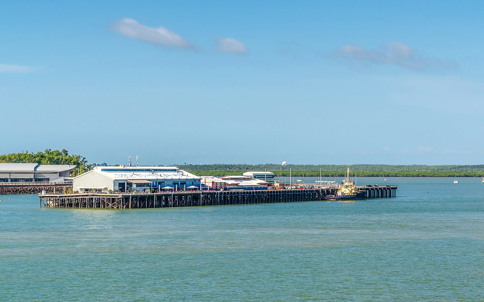 Stokes Hill Wharf in Darwin with boats docked and surrounding water.