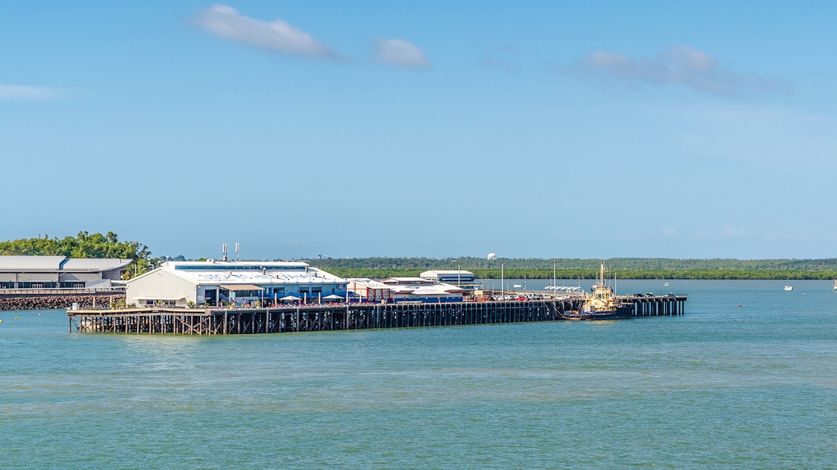 Stokes Hill Wharf in Darwin with boats docked and surrounding water.