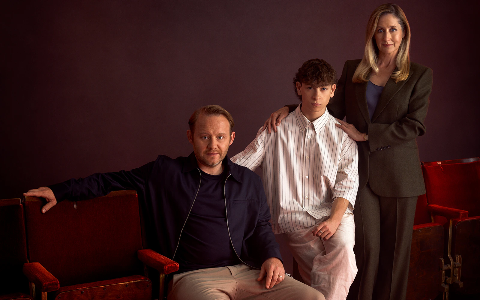Cast members of "Stranger Things The First Shadow" seated in theater chairs.