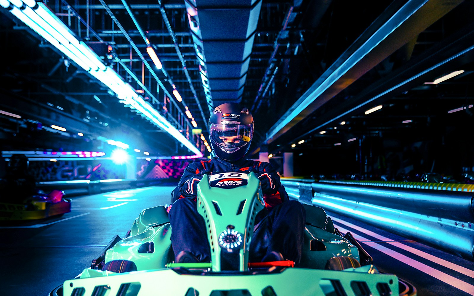 Guest driving at Elite F1 Drive experience in London indoor track.