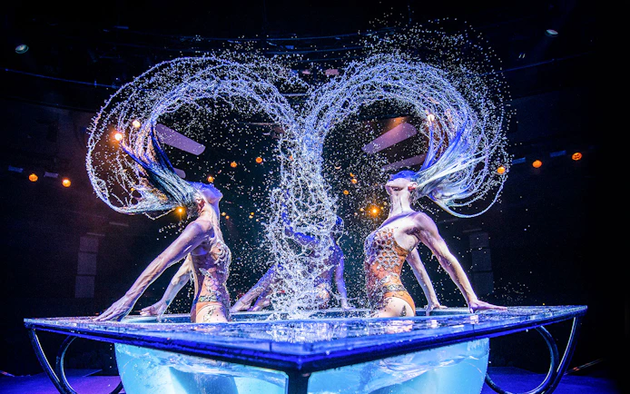 Performers in water tank during WOW: The Vegas Spectacular show.