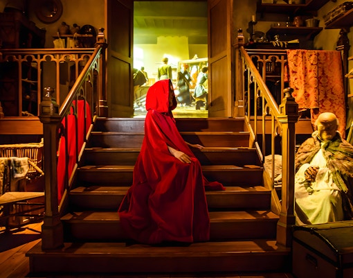Bruges Historium interior with medieval artifacts and interactive exhibits.