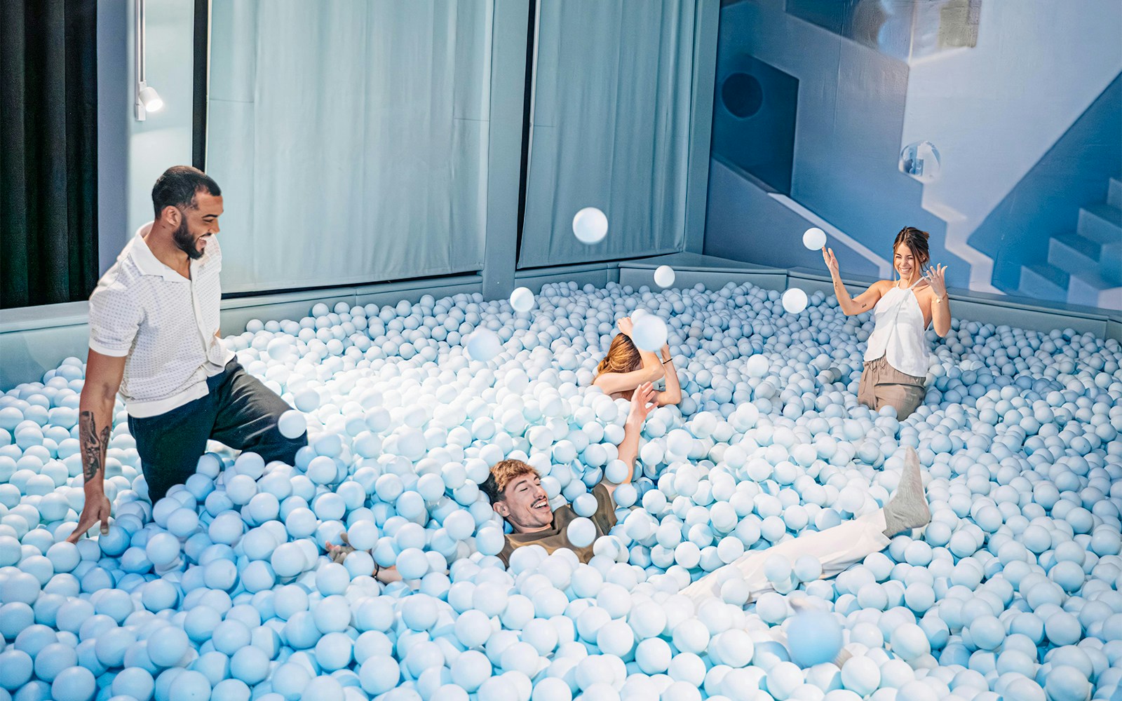 Visitors exploring interactive art installations at Ikono Madrid.