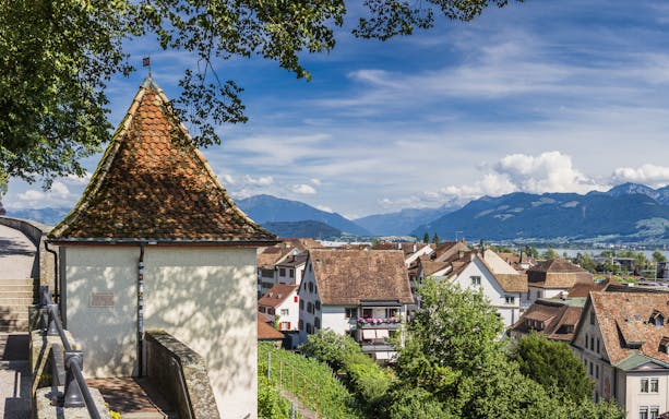 Rooftops of Rapperswil with view of Lake Zurich and mountains, Switzerland.
