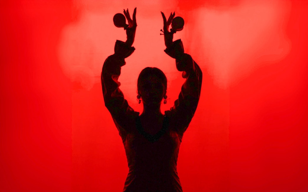 Flamenco dancer silhouette with castanets in Barcelona.