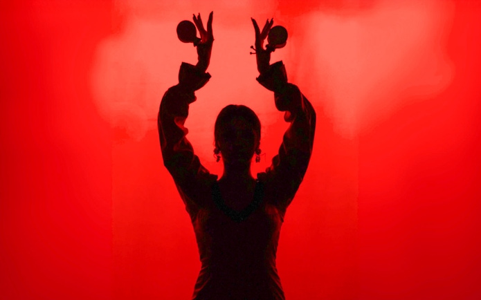 Flamenco dancer silhouette with castanets in Barcelona.