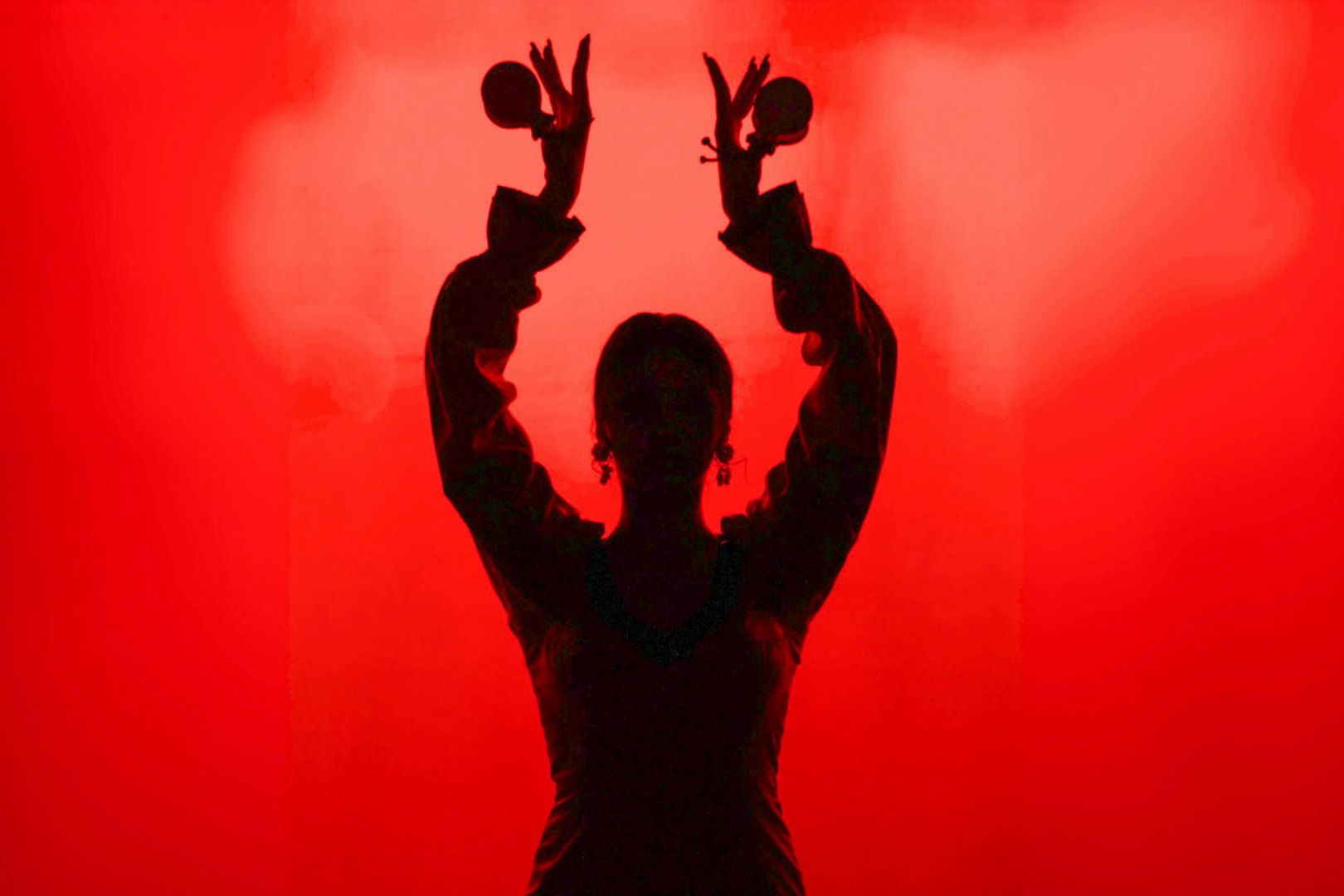 Flamenco dancer silhouette with castanets in Barcelona.
