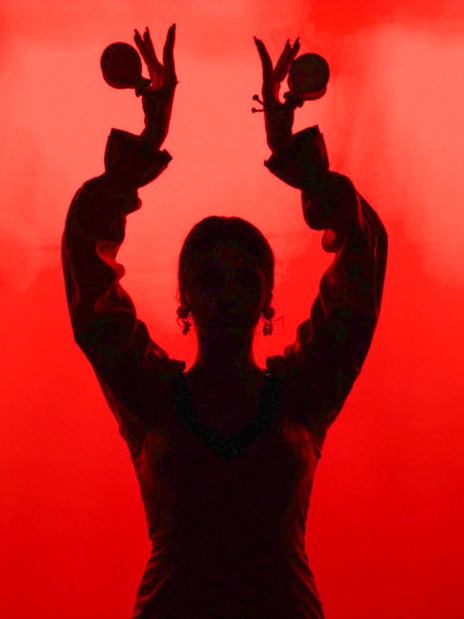 Flamenco dancer silhouette with castanets in Barcelona.
