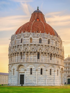 Battistero di San Giovanni in Pisa, Italy, with its distinctive dome and intricate facade.