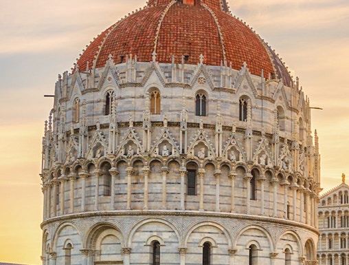 Battistero di San Giovanni in Pisa, Italy, with its distinctive dome and intricate facade.