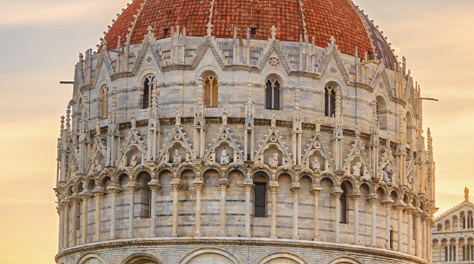 Battistero di San Giovanni in Pisa, Italy, with its distinctive dome and intricate facade.