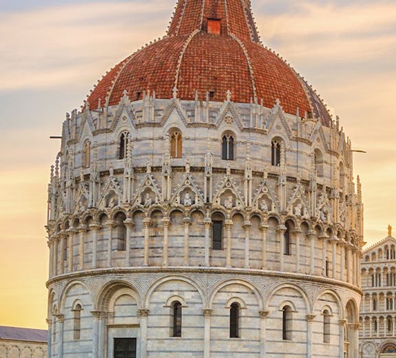 Battistero di San Giovanni in Pisa, Italy, with its distinctive dome and intricate facade.