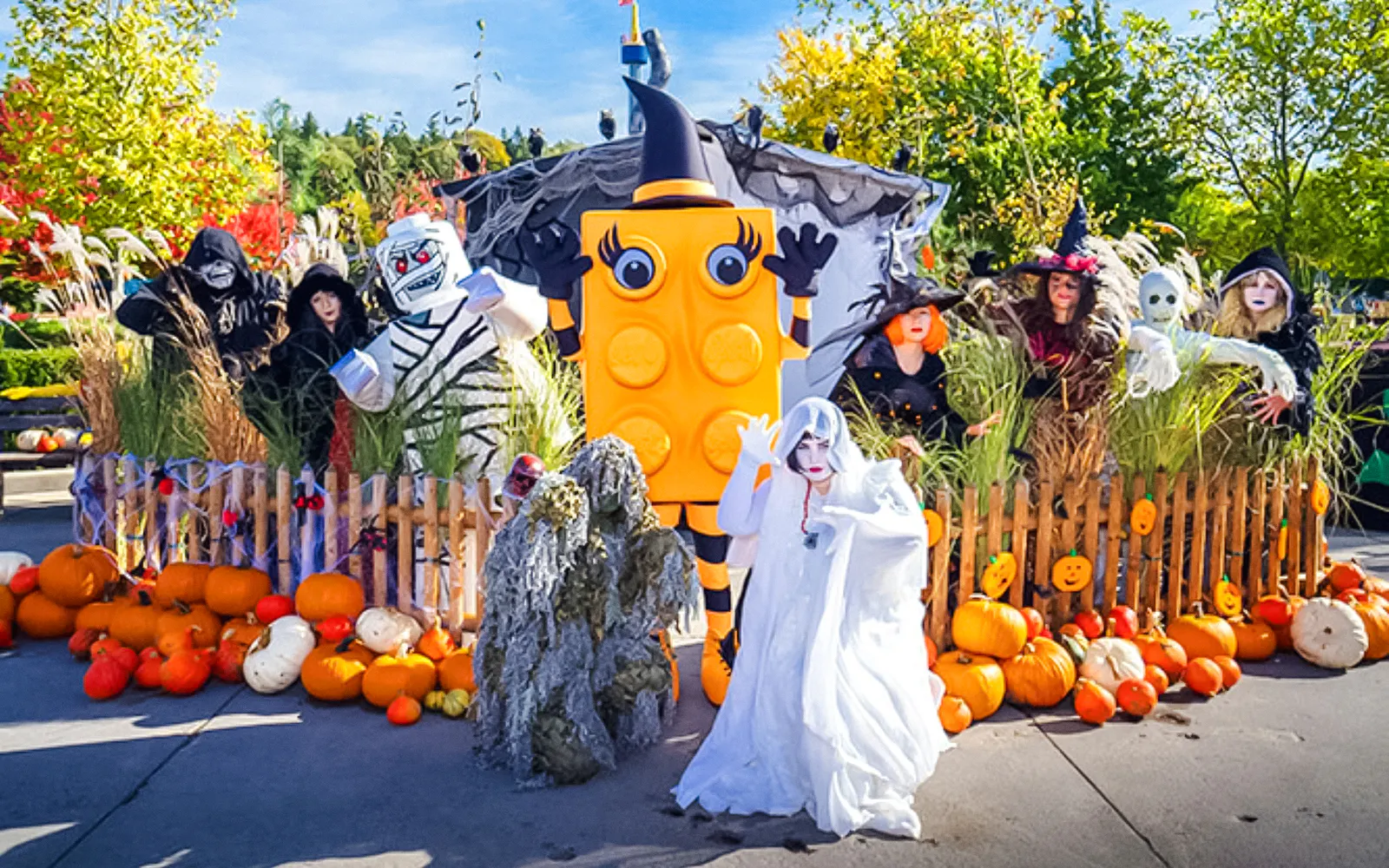 Costumed characters and pumpkins at Halloween event in Legoland Billund.