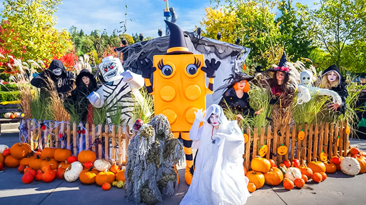 Costumed characters and pumpkins at Halloween event in Legoland Billund.