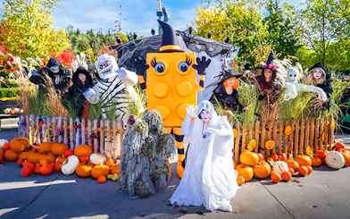 Costumed characters and pumpkins at Halloween event in Legoland Billund.