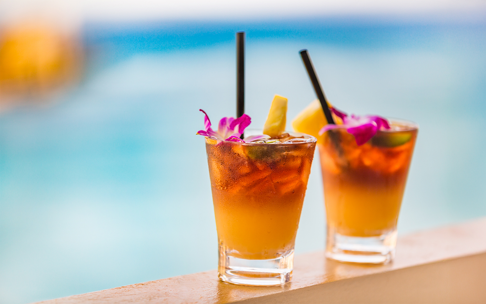 Mai tai cocktails with pineapple and flowers on a cruise in Honolulu, Hawaii.
