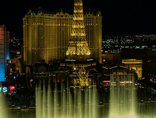 Eiffel Tower replica and fountain show at night, Las Vegas.