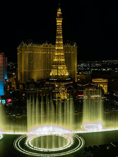 Eiffel Tower replica and fountain show at night, Las Vegas.