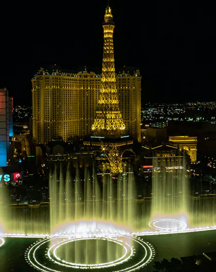 Eiffel Tower replica and fountain show at night, Las Vegas.