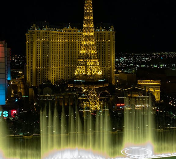 Eiffel Tower replica and fountain show at night, Las Vegas.