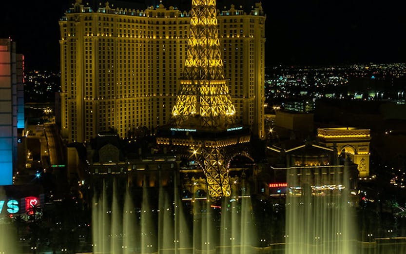Eiffel Tower replica and fountain show at night, Las Vegas.