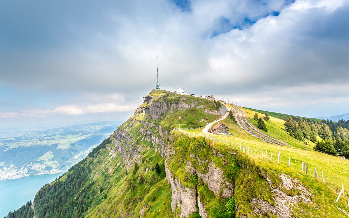 Mount Rigi summit with railway tracks and panoramic view of Lake Lucerne, Switzerland.