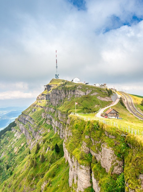 Mount Rigi summit with railway tracks and panoramic view of Lake Lucerne, Switzerland.
