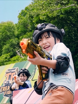 Children playing laser tag at Junglia Okinawa theme park.