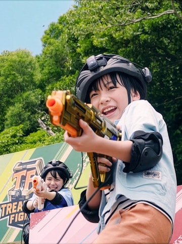 Children playing laser tag at Junglia Okinawa theme park.