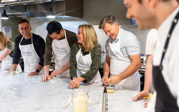 People making pasta during a cooking class in Milan.