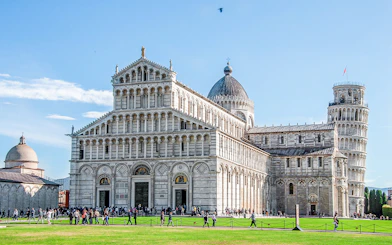 Pisa Cathedral with the Leaning Tower of Pisa in the background, Italy.
