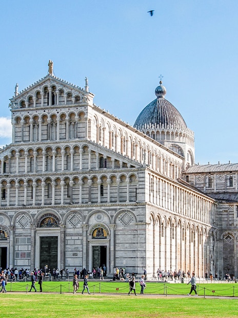 Pisa Cathedral with the Leaning Tower of Pisa in the background, Italy.