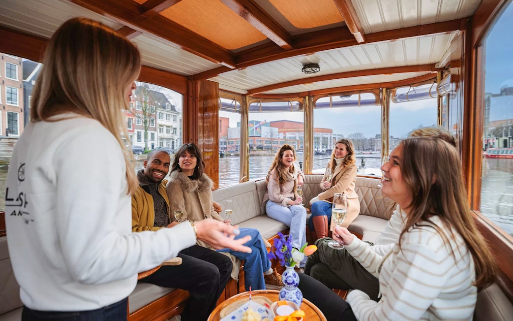 Guests enjoying a luxury romantic cruise on Amsterdam's canals.