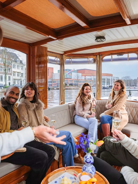 Guests enjoying a luxury romantic cruise on Amsterdam's canals.