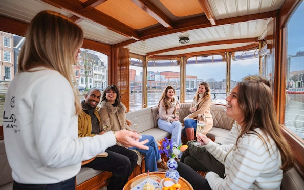 Guests enjoying a luxury romantic cruise on Amsterdam's canals.
