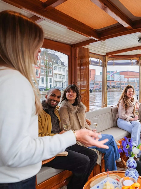 Guests enjoying a luxury romantic cruise on Amsterdam's canals.